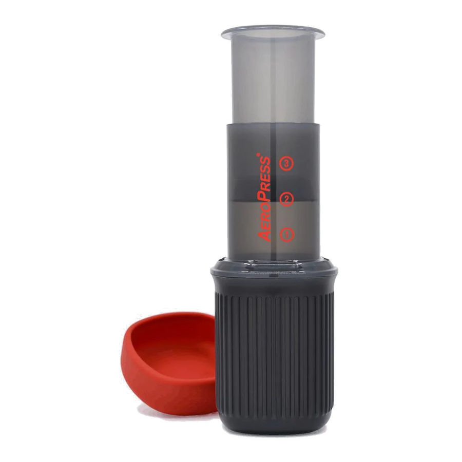 AeroPress Go portable coffee maker with red travel cup – compact and travel-friendly brewing device for smooth, low-acid coffee on the go.