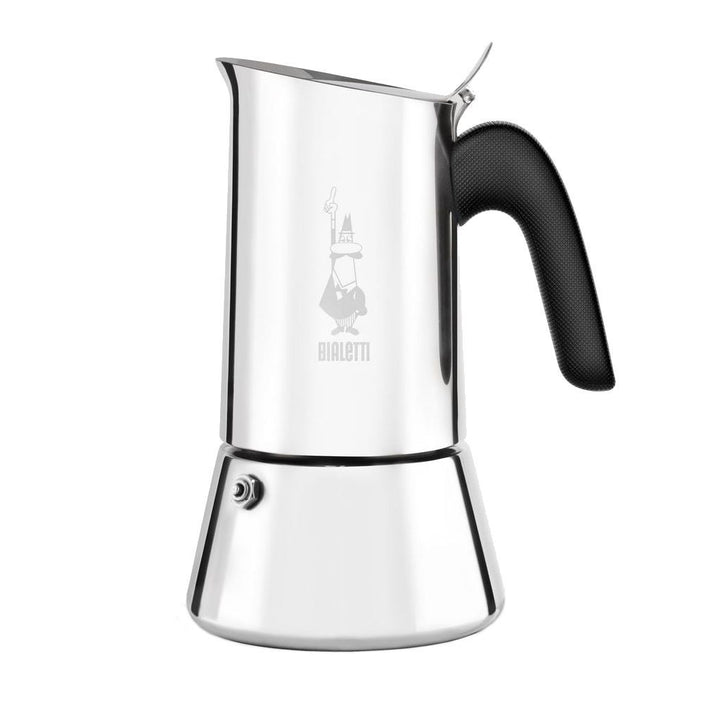 A Bialetti Venus stovetop espresso maker with a silver body and black handle.