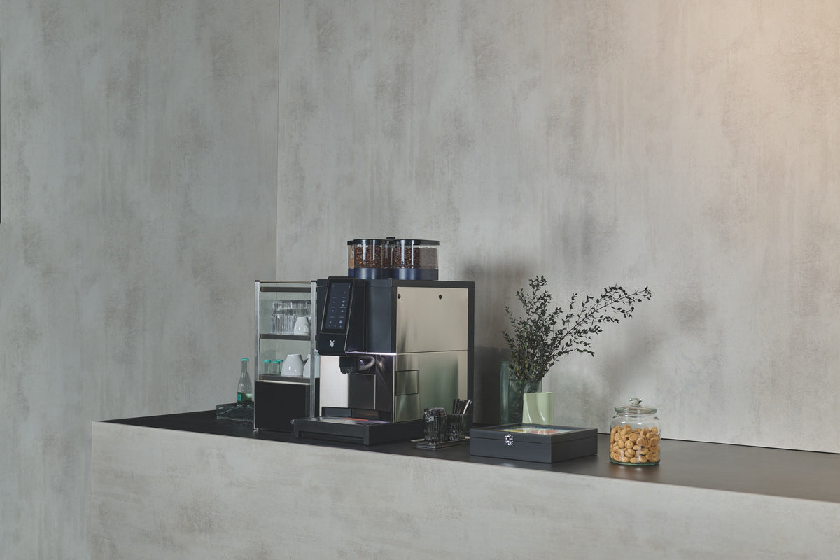 WMF 1300 S coffee machine on a concrete office counter