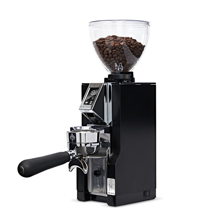 Black coffee grinder with glass container of coffee beans on a white background
