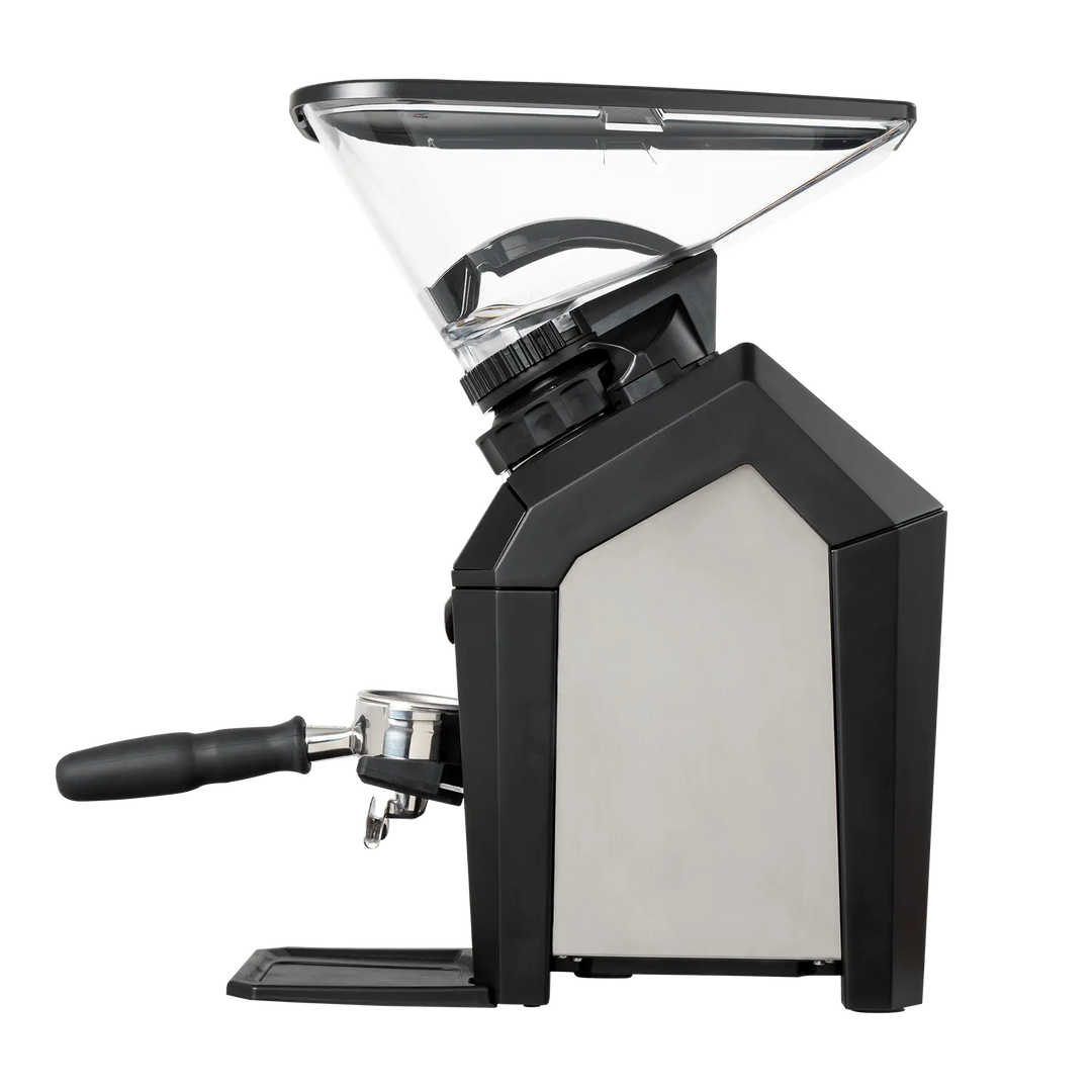 Black manual coffee grinder with clear top on a white background