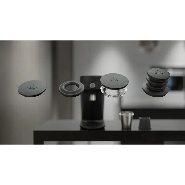 Set of coffee brewing components on a blurred kitchen background