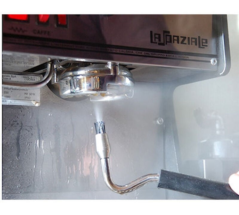 JoeFrex Cleaning Steam Brush cleaning an espresso machine group head