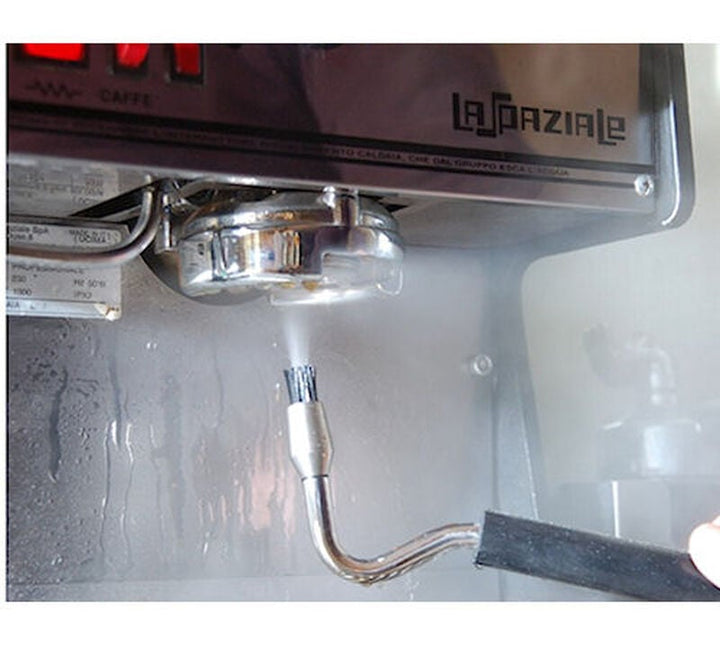 JoeFrex Cleaning Steam Brush cleaning an espresso machine group head